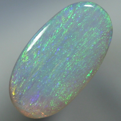 SOLID SEMI BLACK OPAL Iris pattern, green and orange over blue